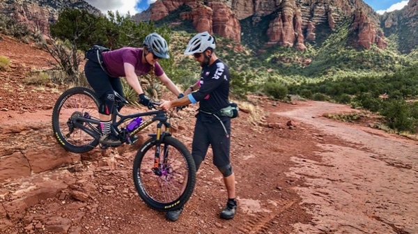 Woman learning how to mountain bike