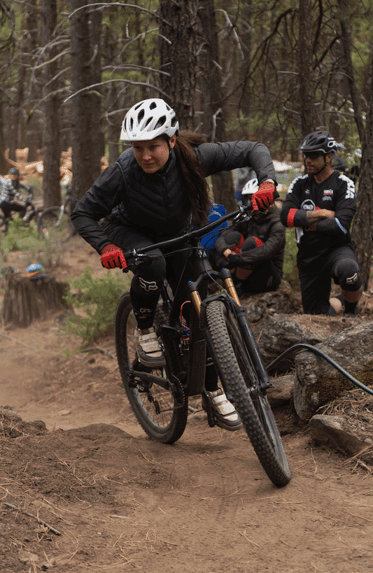 mountain biker cornering during a skills clinic