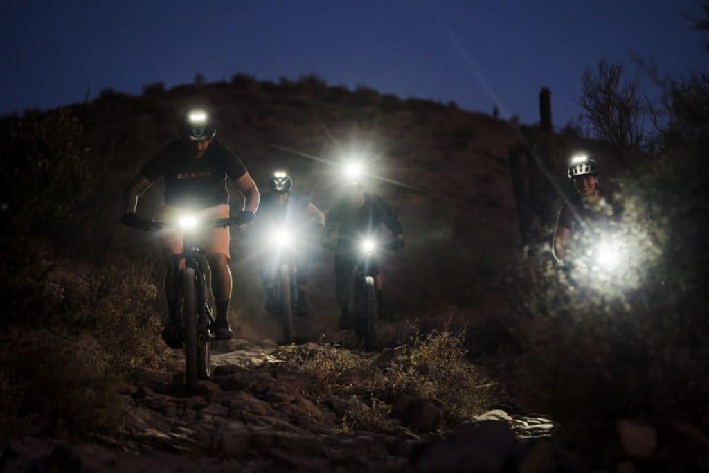 A group of people night riding
