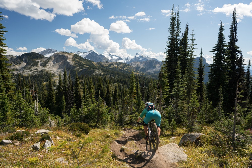 Mountain biker riding down a rocky trail