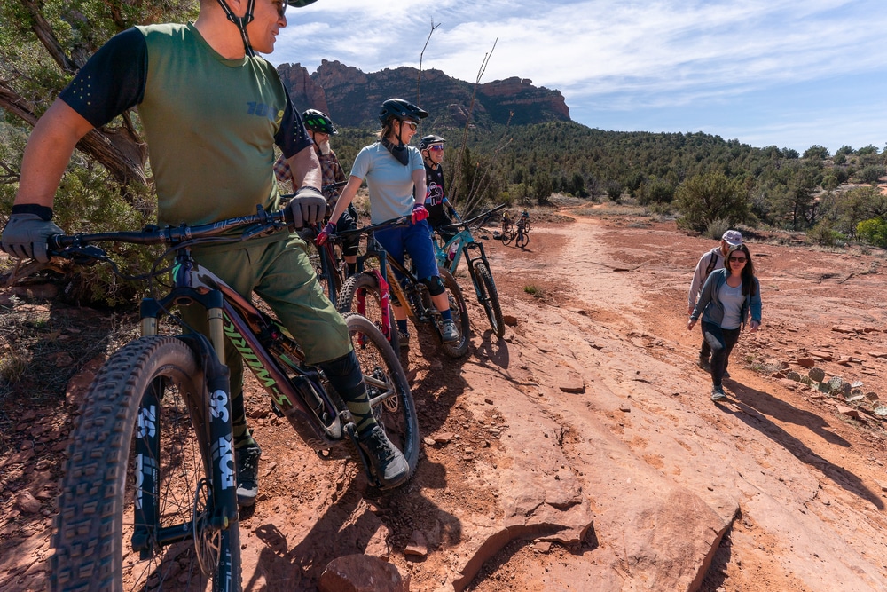 Mountain bikers giving hikers the right of way on a trail