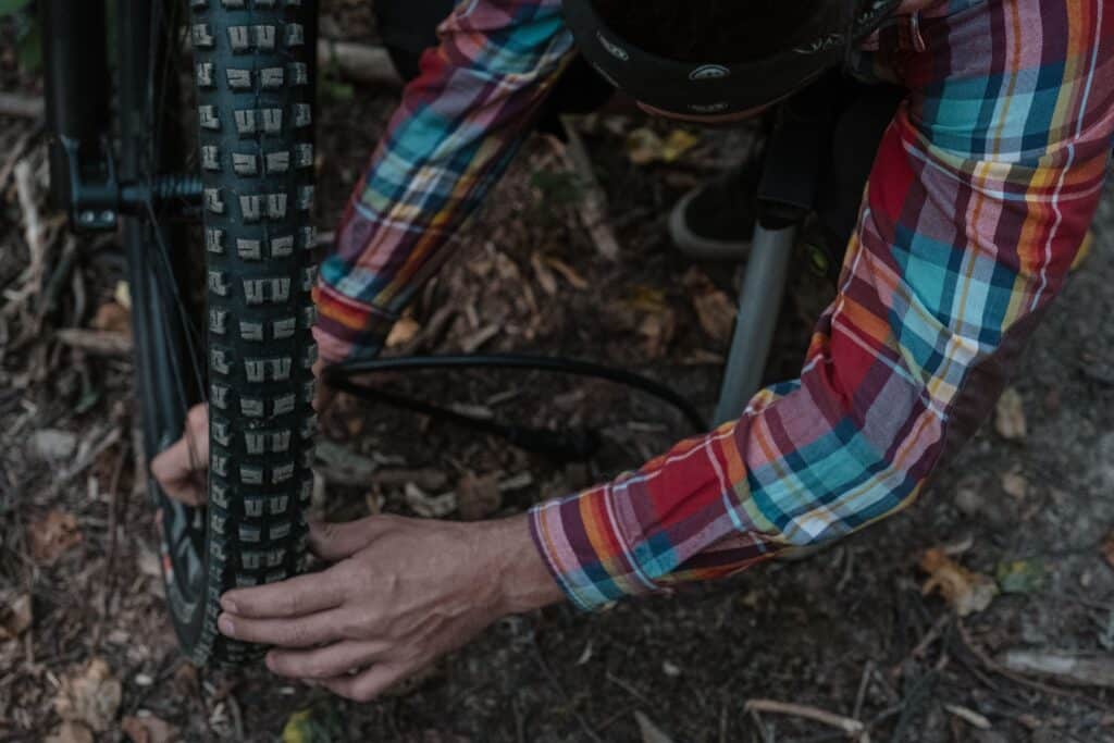 inflating a mountain bike tire